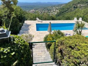 a view of a swimming pool from a house at Stunning Villa 5 bedroom Heaven on earth in Tourrettes-sur-Loup