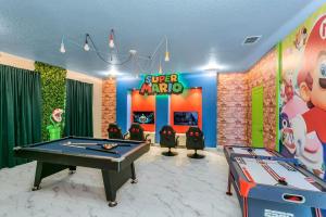 a game room with a ping pong table and ping pong balls at Top Villas - Storey Lake Resort 482 in Kissimmee