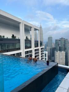 a swimming pool on the roof of a building at Platinum Suites Kuala Lampur by Likehome in Kuala Lumpur