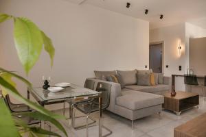 a living room with a couch and a table at Argostoli Cityscape Apartment in Argostoli