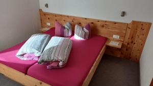 Łóżko lub łóżka w pokoju w obiekcie Haus Patscheider