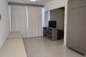TV a/nebo společenská místnost v ubytování Condominio Barretos Thermas Park 401