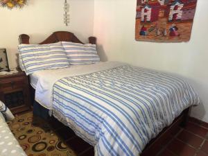 Кровать или кровати в номере Finca Villa Maria - Cabaña
