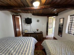 Кровать или кровати в номере Finca Villa Maria - Cabaña +6 фотографий
