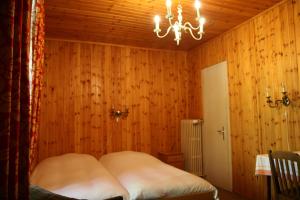 Postelja oz. postelje v sobi nastanitve Hôtel Hermitage