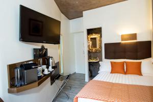 Postel nebo postele na pokoji v ubytování Vaticano Julia Guest House