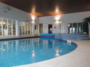 a large swimming pool in the middle of a building at 19 Burgh Island Causeway in Kingsbridge