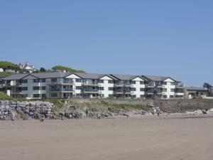 a group of people on the beach in front of a building at 19 Burgh Island Causeway in Kingsbridge