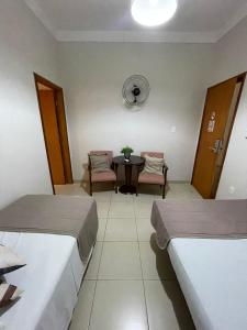 Cama ou camas em um quarto em Hotel Jardim
