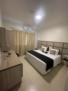 Cama ou camas em um quarto em Hotel Jardim