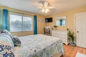 a bedroom with a bed and a ceiling fan at Myrtle Beach Retreat with Balcony Near Boardwalk! in Myrtle Beach
