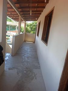a hallway of a house with water on the ground at Casa de Andressa in Morro dʼAnta