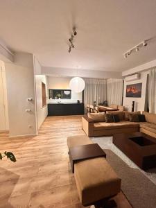 a large living room with a couch and a table at Apartament Anca in Sibiu