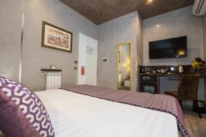 Postel nebo postele na pokoji v ubytování Vaticano Julia Guest House
