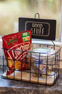 a basket filled with food and a sign that says good stuff at Rhön & Relax Schwarze Berge - Garten in Wildflecken +15 photos