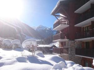 a snow covered building with the sun in the background at Appartement Arêches-Beaufort, 2 pièces, 4 personnes - FR-1-342-154 in Arêches-Beaufort