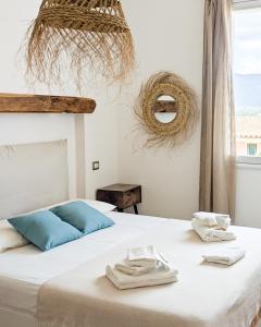 Postel nebo postele na pokoji v ubytování Arya Room Villasimius + 9 fotografií