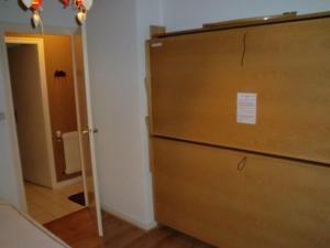 a room with a dresser and a door to a hallway at Appartement Huez, 2 pièces, 6 personnes - FR-1-405-194 in LʼHuez