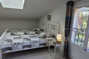 a bedroom with a bed and a window at La villa les parfums d’Ete in Ornaisons +58 photos