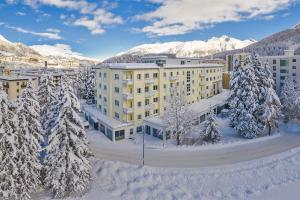 an aerial view of a hotel in the snow at Hotel Laudinella in St. Moritz