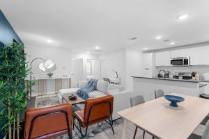 a living room with a couch and a table at Luxurious Apartment in Downtown Dallas 2BR/1 BATH in Dallas +3 photos