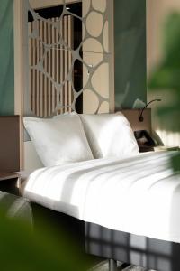 Uma cama ou camas num quarto em Otium Hotel Roosendaal