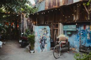 a bike parked in front of a building at 77 Old Town in Bangkok