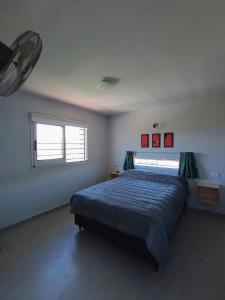 a bedroom with a large bed and a window at Casa Estancia Vieja in Cordoba +14 photos