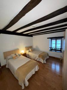 Katil atau katil-katil dalam bilik di Etxeberriko Borda