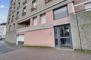 a building with a door on the side of it at Chic and spacious apart with parking in Cergy
