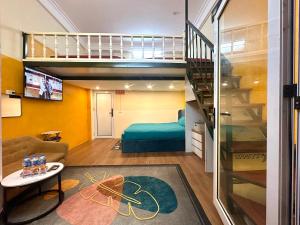 a room with a bunk bed and a living room at Center of Old Quarter, K Home, 1 minute to Hoan Kiem Lake in Hanoi
