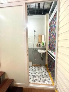 a bathroom with a shower and a sink at Center of Old Quarter, K Home, 1 minute to Hoan Kiem Lake in Hanoi
