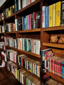 a book shelf filled with lots of books at Da Fabio in Negril