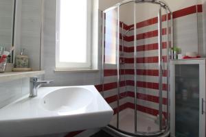 a bathroom with a sink and a shower at Solemare in Tortoreto Lido