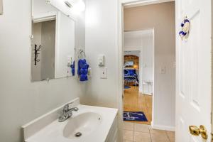 a bathroom with a sink and a mirror at Family-Friendly Ocean City Condo Walk to Beach! in Ocean City +18 photos