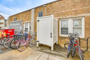 a group of bikes parked next to a brick building at Family-Friendly Ocean City Condo Walk to Beach! in Ocean City