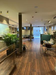 a large room with tables and chairs in a building at AZ Hotel San Valero in Zaragoza