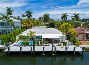 an aerial view of a house with a dock at Casa Flamingo Intracoastal Front with Heated Pool a and 75 ft Dock in Fort Lauderdale