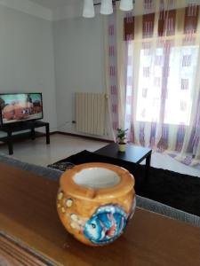 a living room with a vase sitting on a table at Buen Retiro - Bellona in Bellona