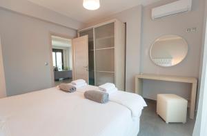 A bed or beds in a room at Bellevue Villas with private pool