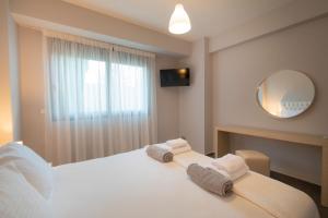 A bed or beds in a room at Bellevue Villas with private pool