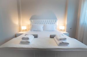 A bed or beds in a room at Bellevue Villas with private pool