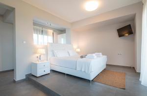 A bed or beds in a room at Bellevue Villas with private pool