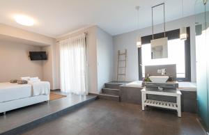 A bed or beds in a room at Bellevue Villas with private pool