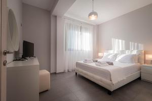A bed or beds in a room at Bellevue Villas with private pool
