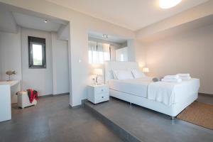 A bed or beds in a room at Bellevue Villas with private pool