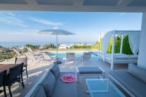 A balcony or terrace at Bellevue Villas with private pool