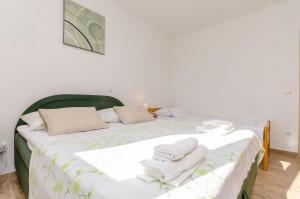 Postel nebo postele na pokoji v ubytování Apartments Toni