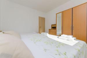 Postel nebo postele na pokoji v ubytování Apartments Toni