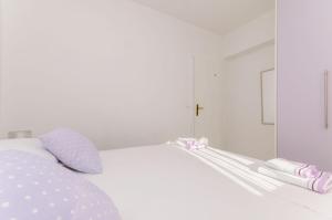 Postel nebo postele na pokoji v ubytování Apartments Toni